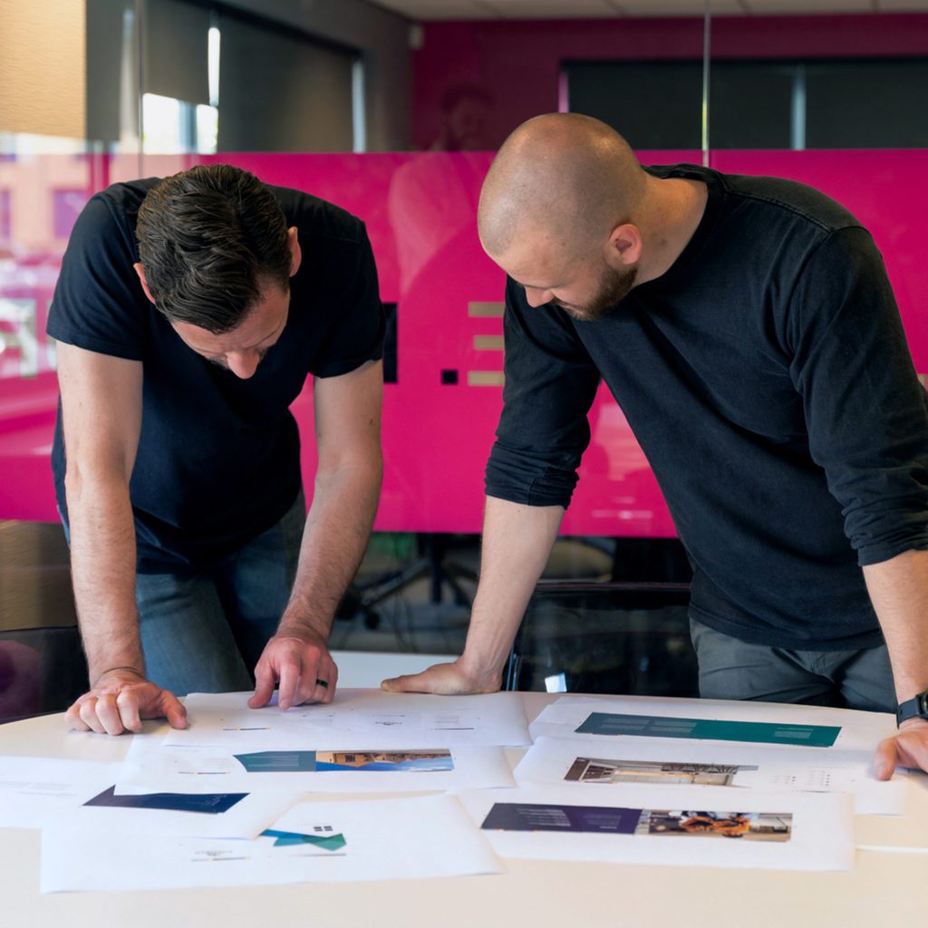 Print Design Agency | Rich and Tom Reviewing Brochure