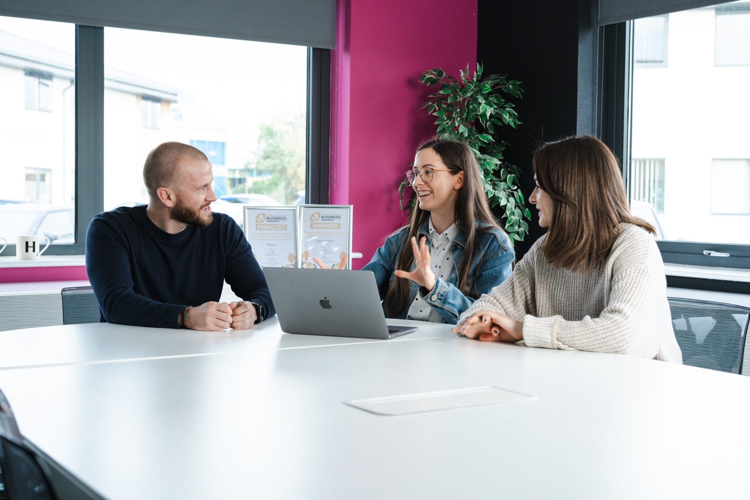 3 people discussing marketing strategies - Reech Media