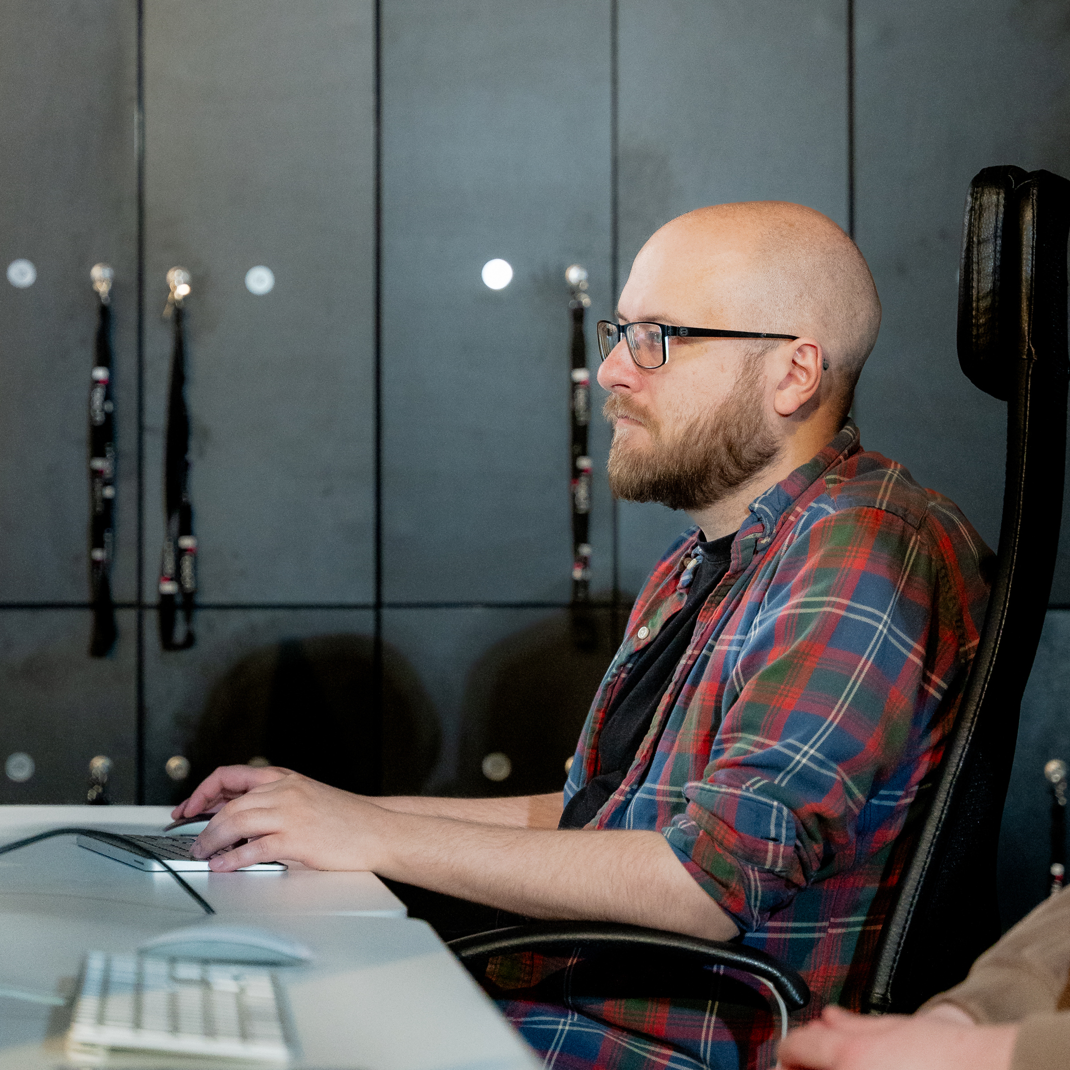 An experienced web developer building custom website integrations at a modern workstation.