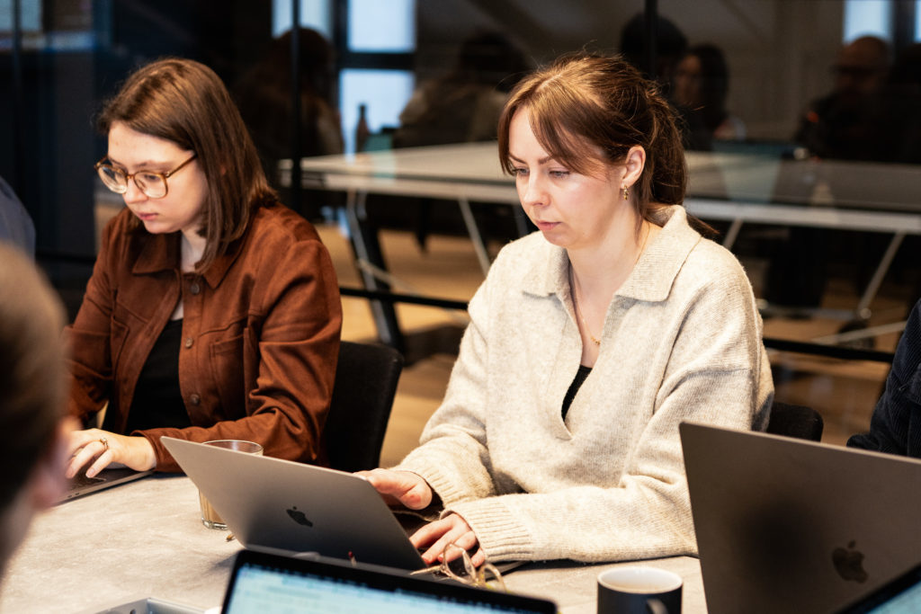 Two people working on a strategy for a business