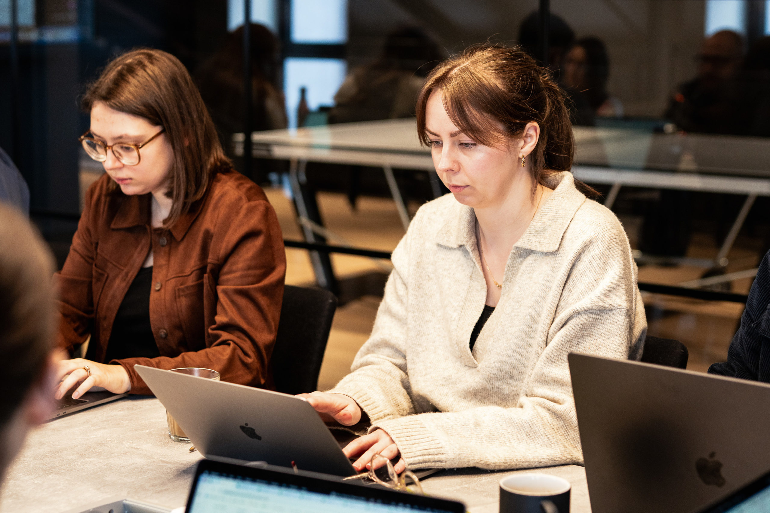 Two people working on a strategy for a business